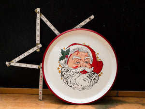 vintage red and white christmas tray featuring a drawing of santa claus 
